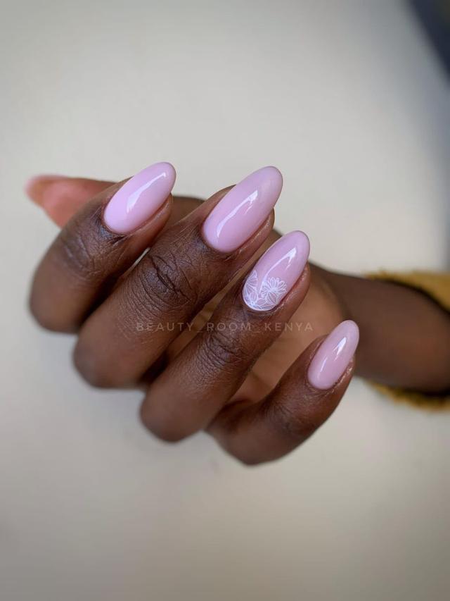 Lilac almond manicure with lace flower accent