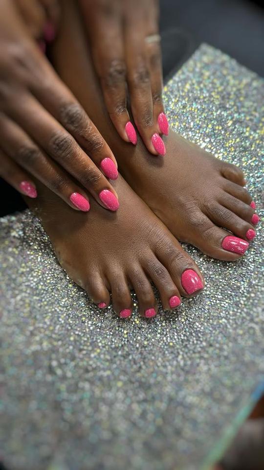 Matching pink glitter manicure and pedicure