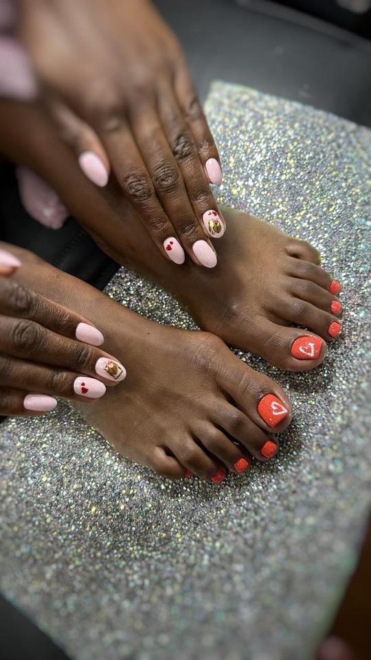 Pink manicure with hearts and red heart pedicure