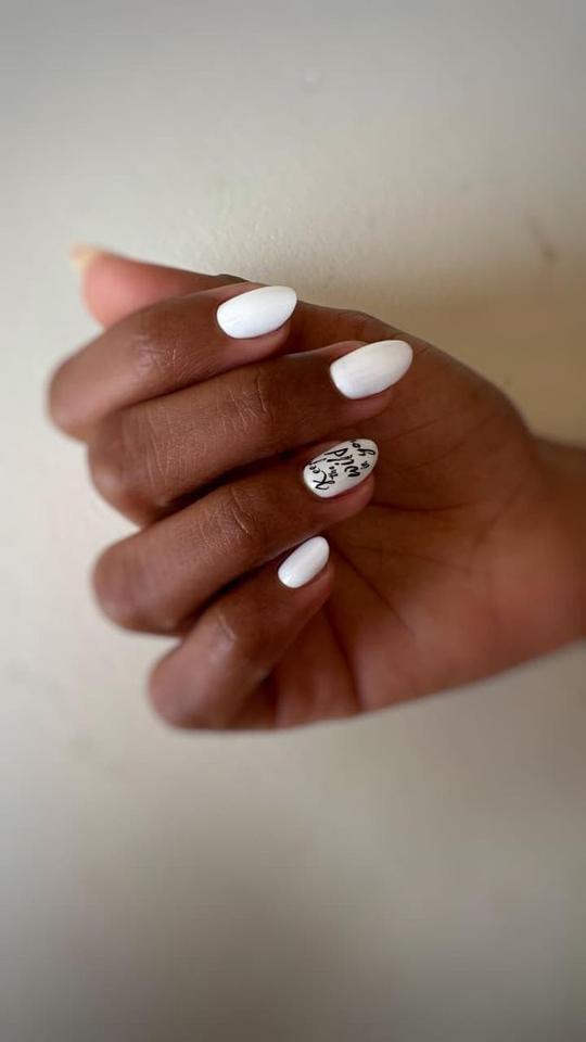 Milk white manicure with script accent